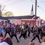 Photo of the ladies of Louisiana LunaChicks entertaining at the 2023 Krewe de Riviere Mardi Gras parade in Monroe, Louisiana.