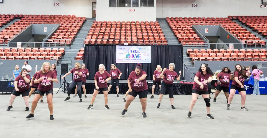 The LunaChicks performing and painting faces at the 2024 Community Health & Wellness Expo at the Monroe Civic Center.