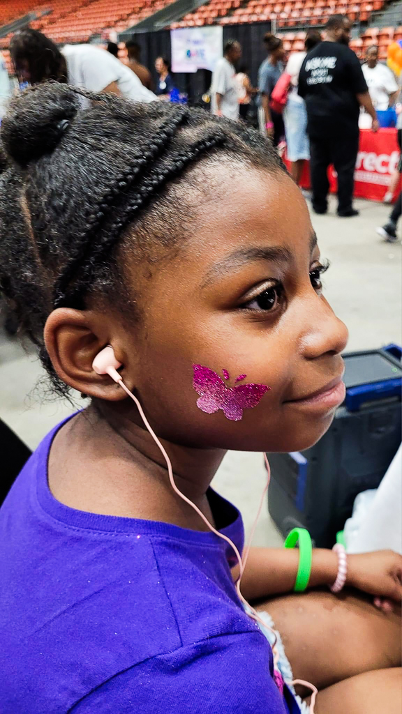 The LunaChicks performing and painting faces at the 2024 Community Health & Wellness Expo at the Monroe Civic Center.